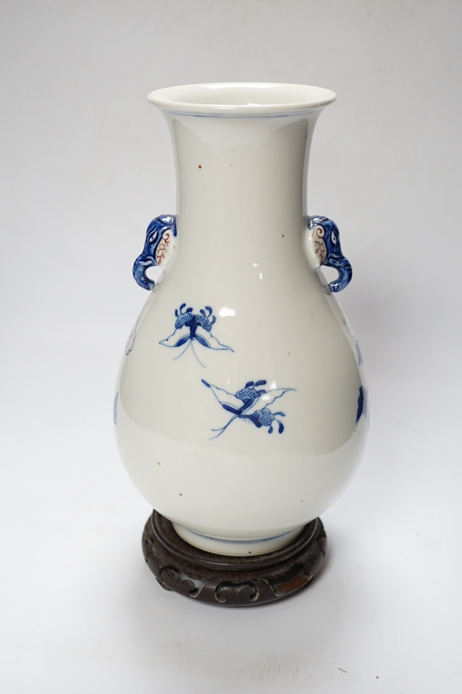 A Chinese underglaze blue and copper red pear shaped vase, on stand, 31cm high including stand